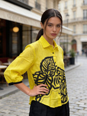 Side profile of yellow linen embroidered shirt for women