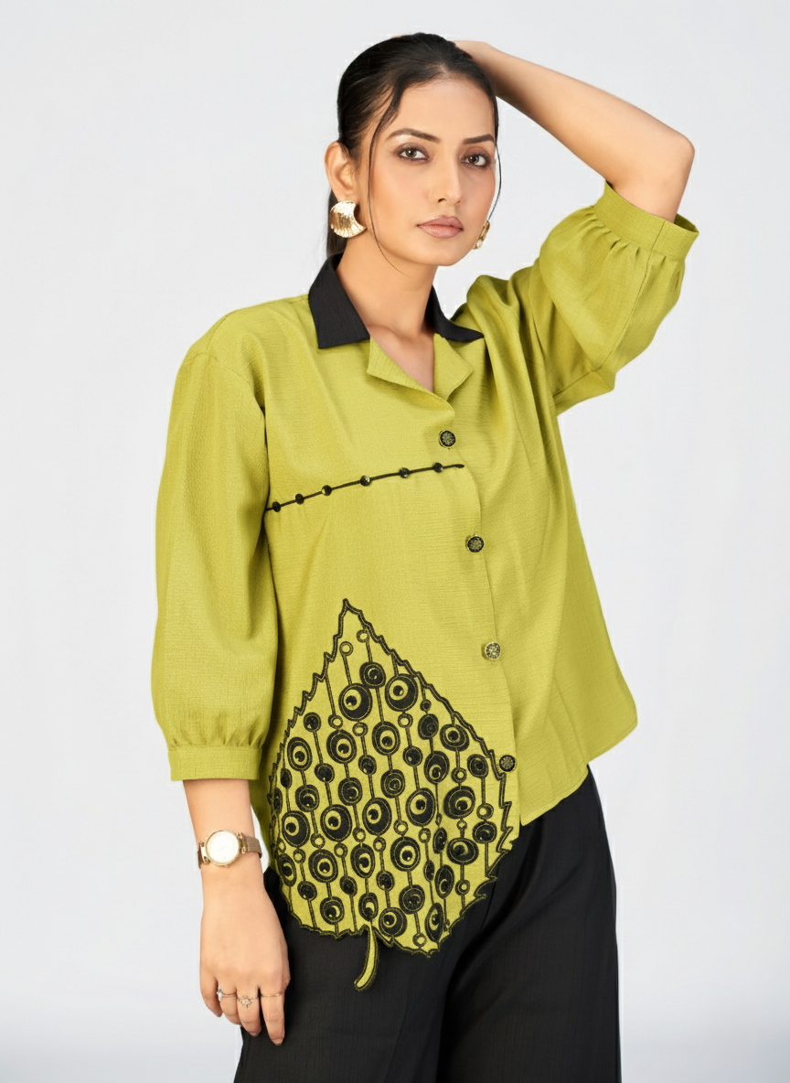 Elegant women’s beige shirt featuring black stitched design across the chest.