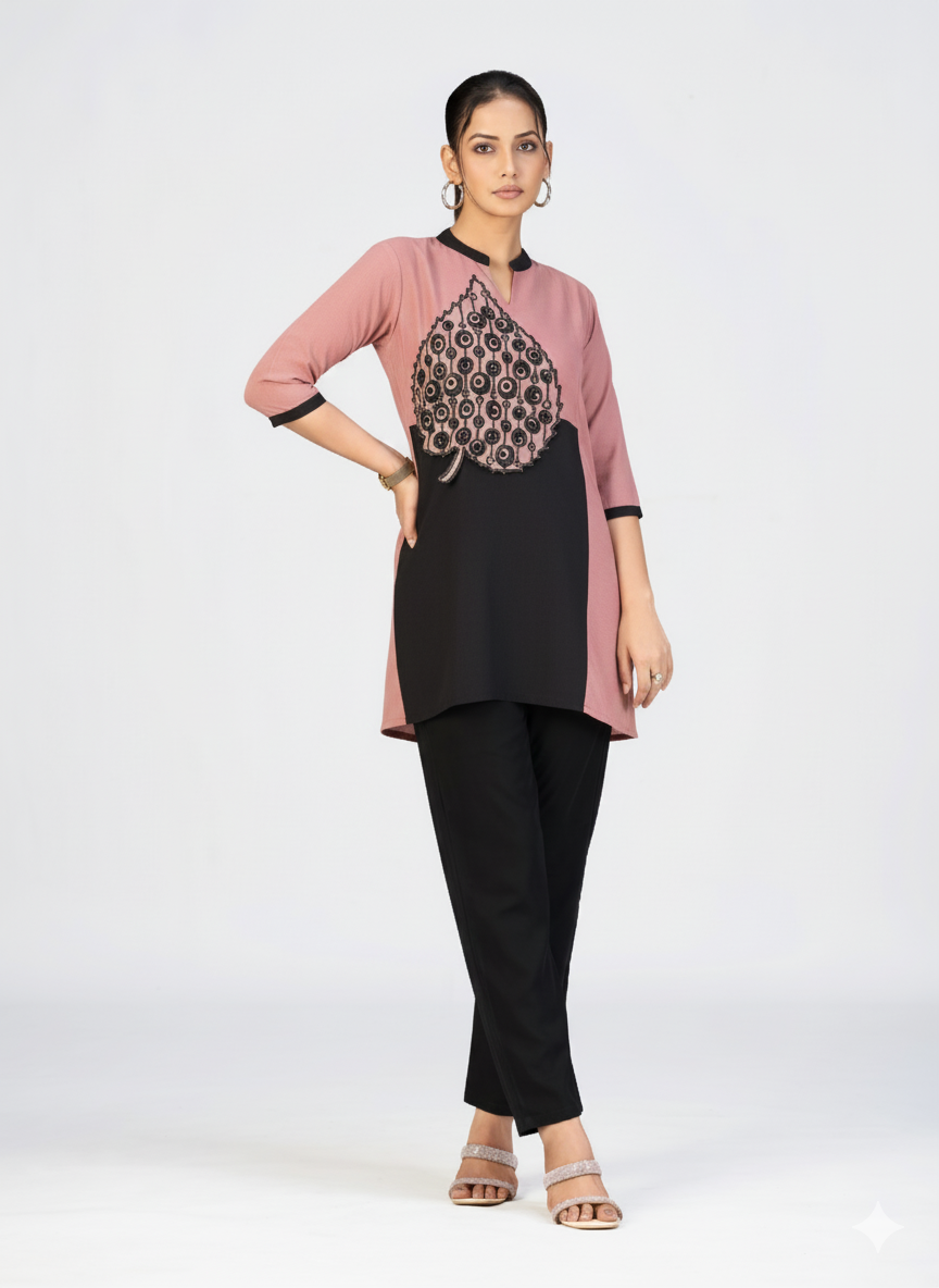 Contemporary ethnic kurti design with dual-tone pattern and artistic applique work.