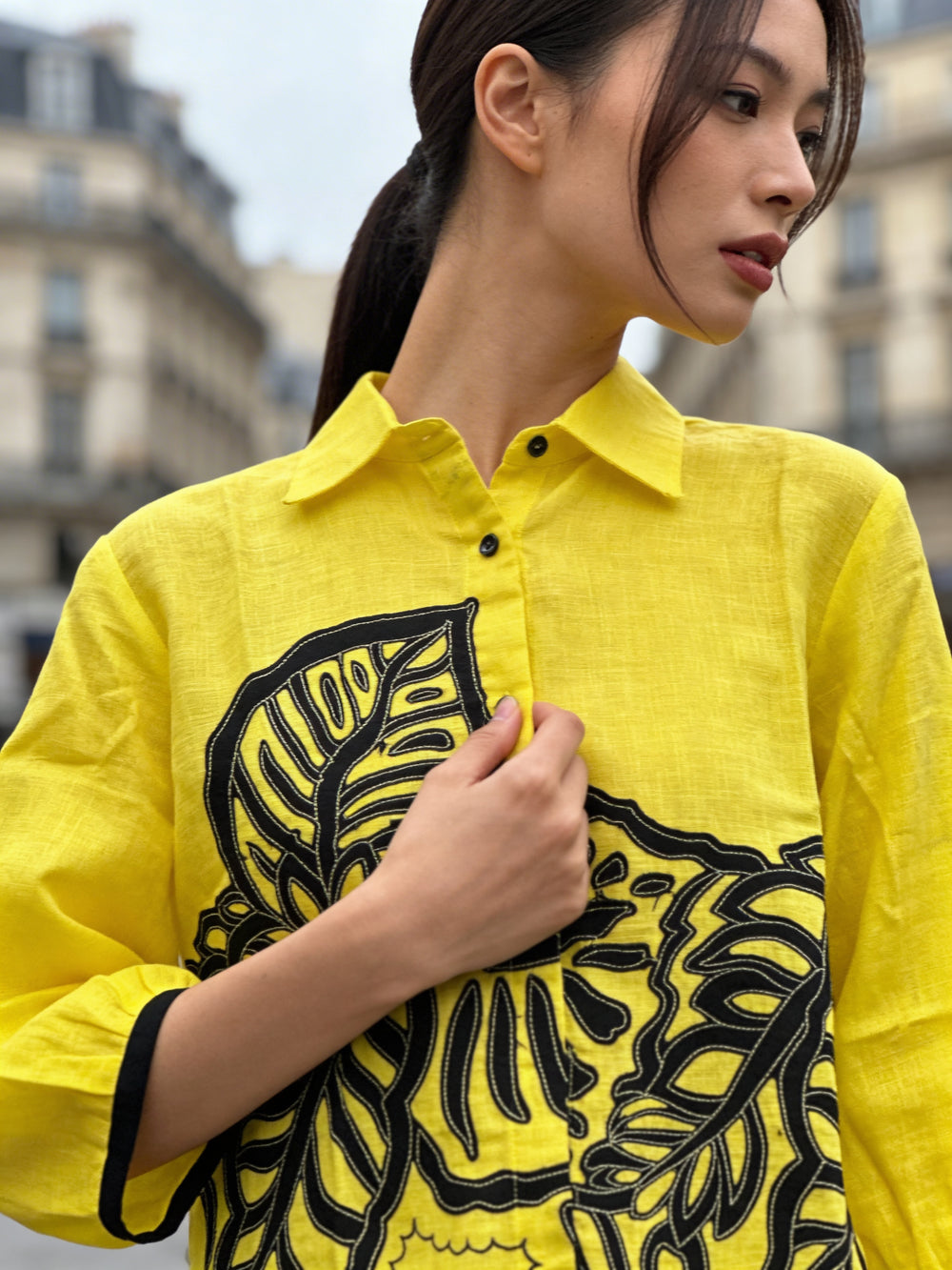 Back view of relaxed fit yellow linen women’s shirt