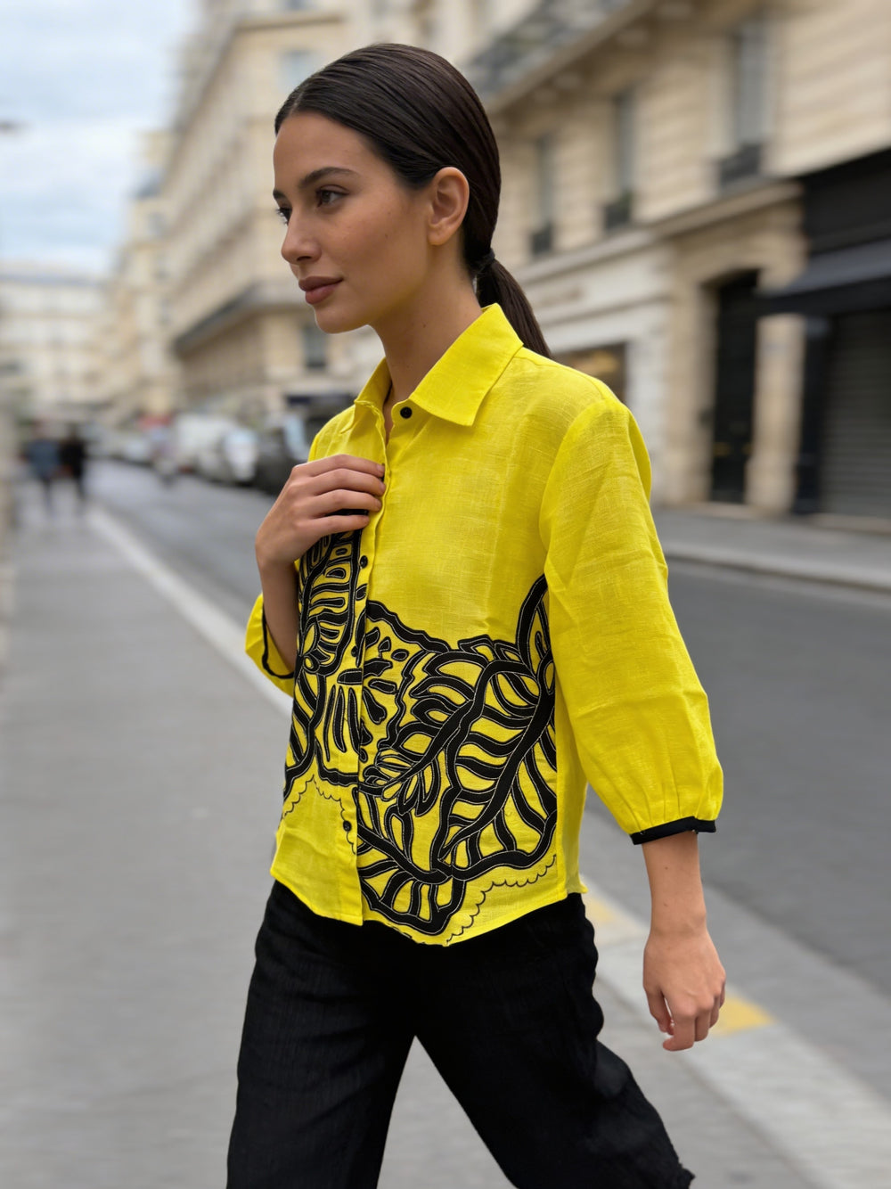 Premium linen fabric texture of yellow embroidered women’s top