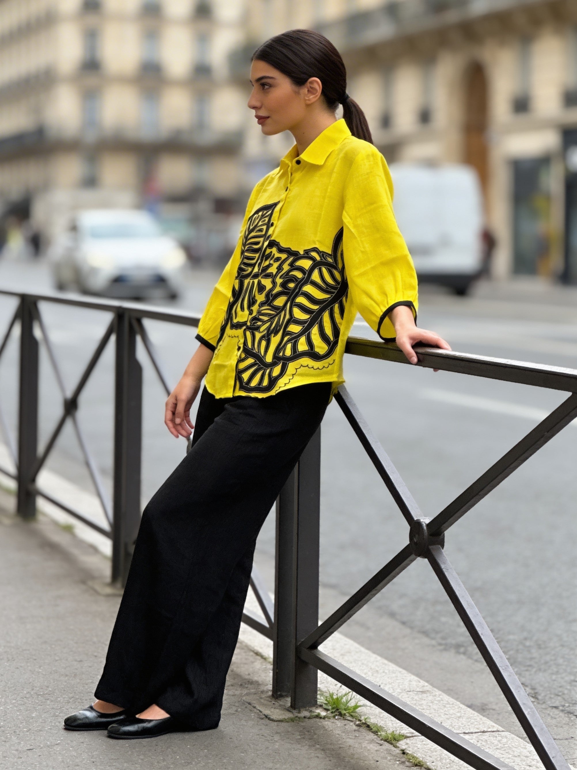 Stylish yellow embroidered shirt paired with black trousers