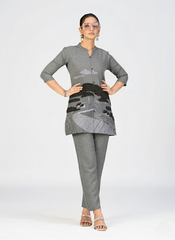 High-detail image of pink textured kurti with black embroidered landscape pattern.